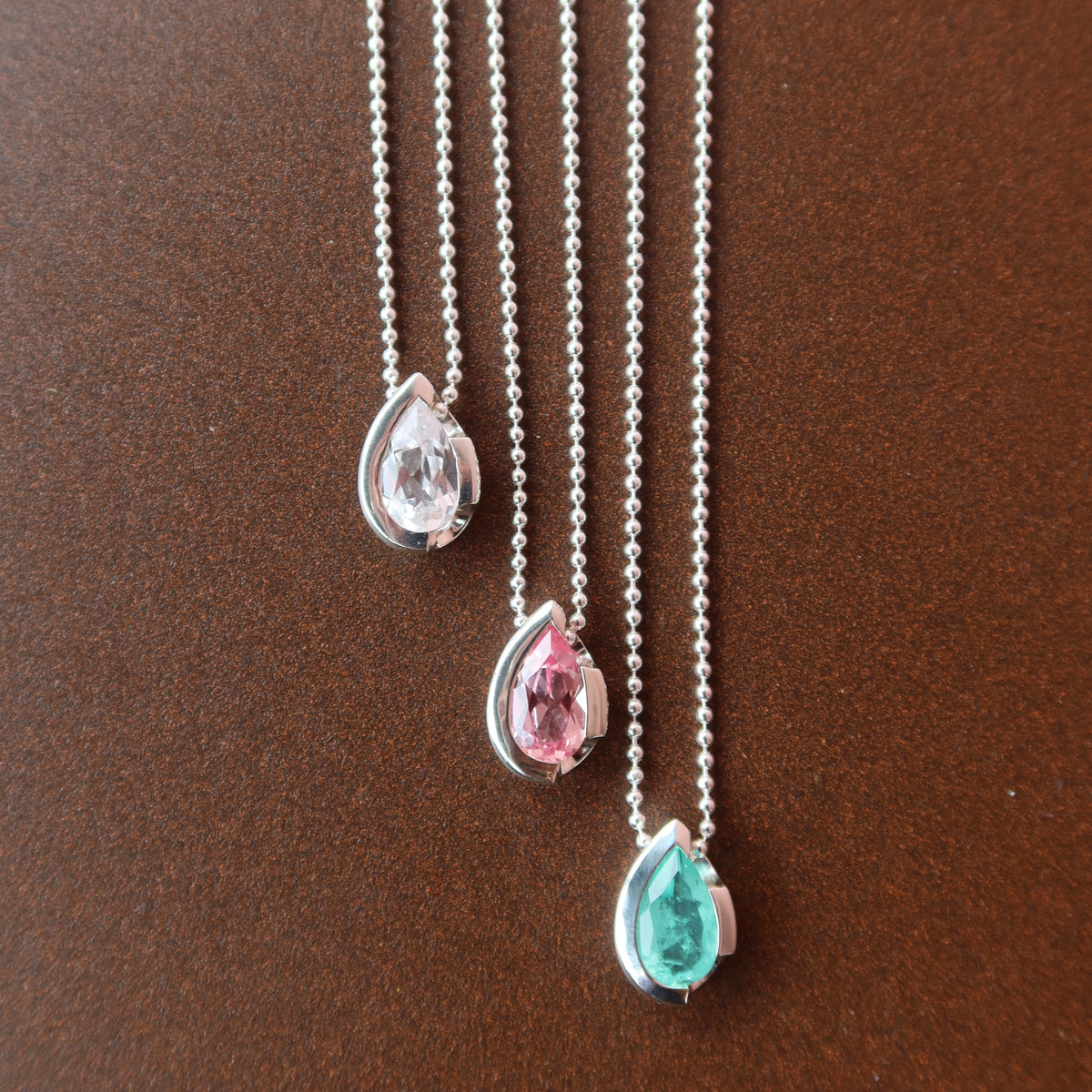 FLOAT™️ - Pear Cut Pendant - Sterling Silver & White Sapphire