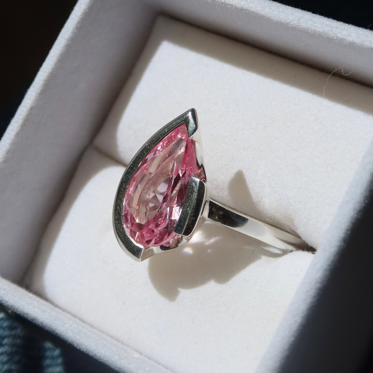 FLOAT™️ - Pear Cut Ring - Sterling Silver & Rosie Corundum