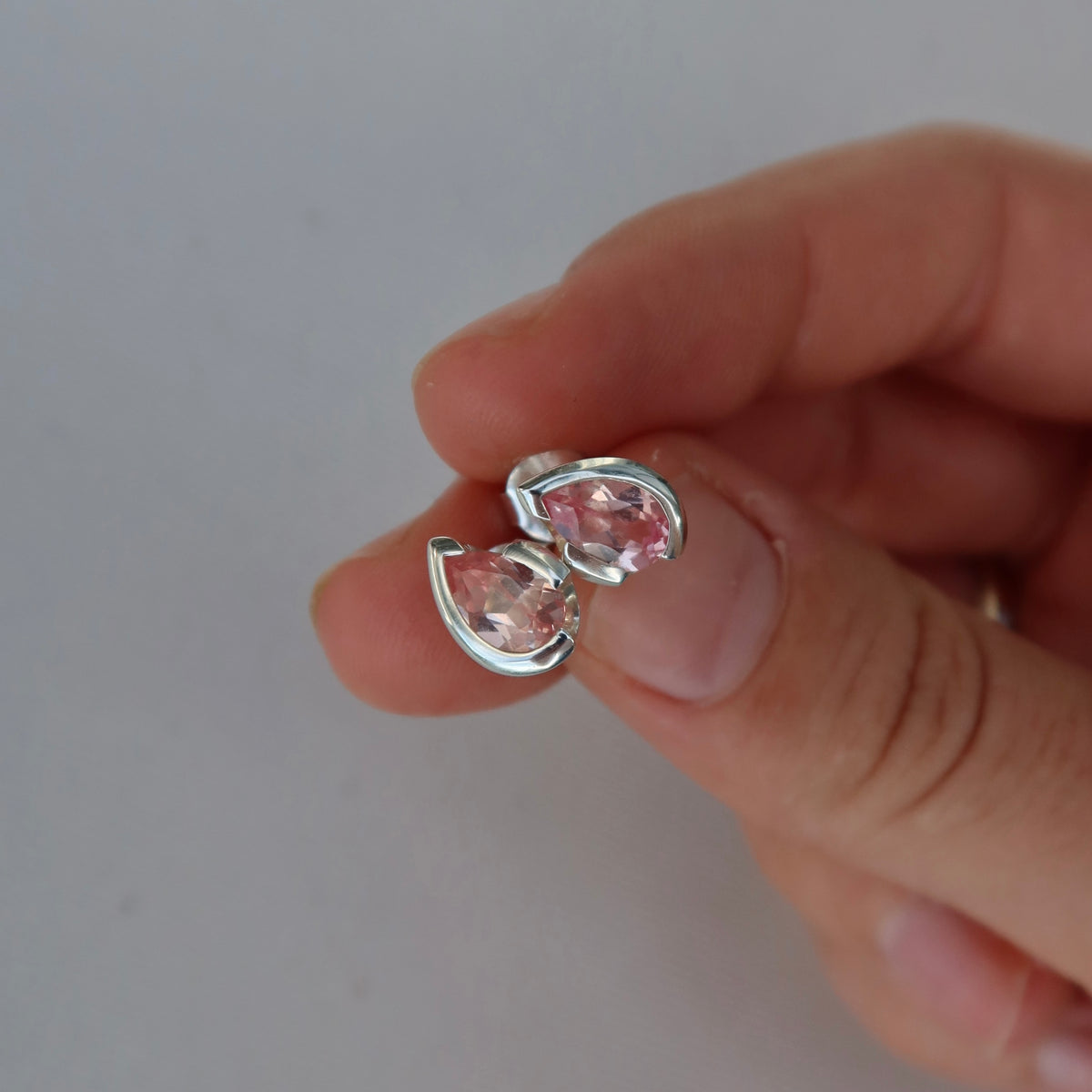 FLOAT™️ - Pear Cut Stud Earrings - Sterling Silver & Rosie Corundum